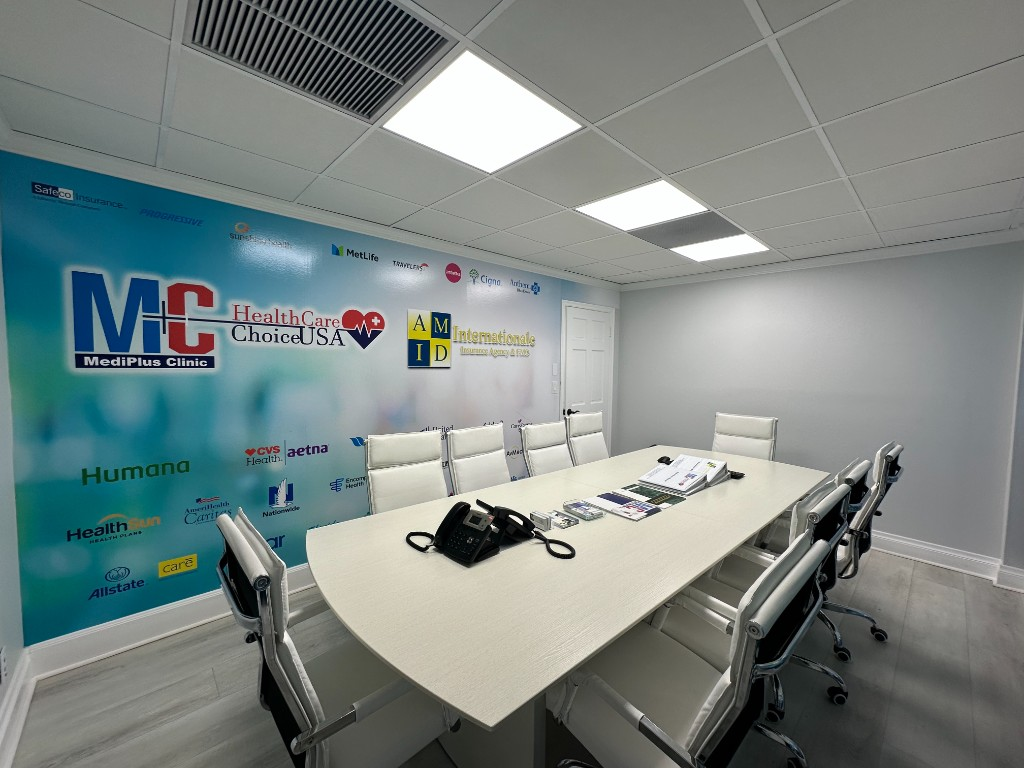 MediPlus Clinic corporate headquarters conference room with partner insurance logos